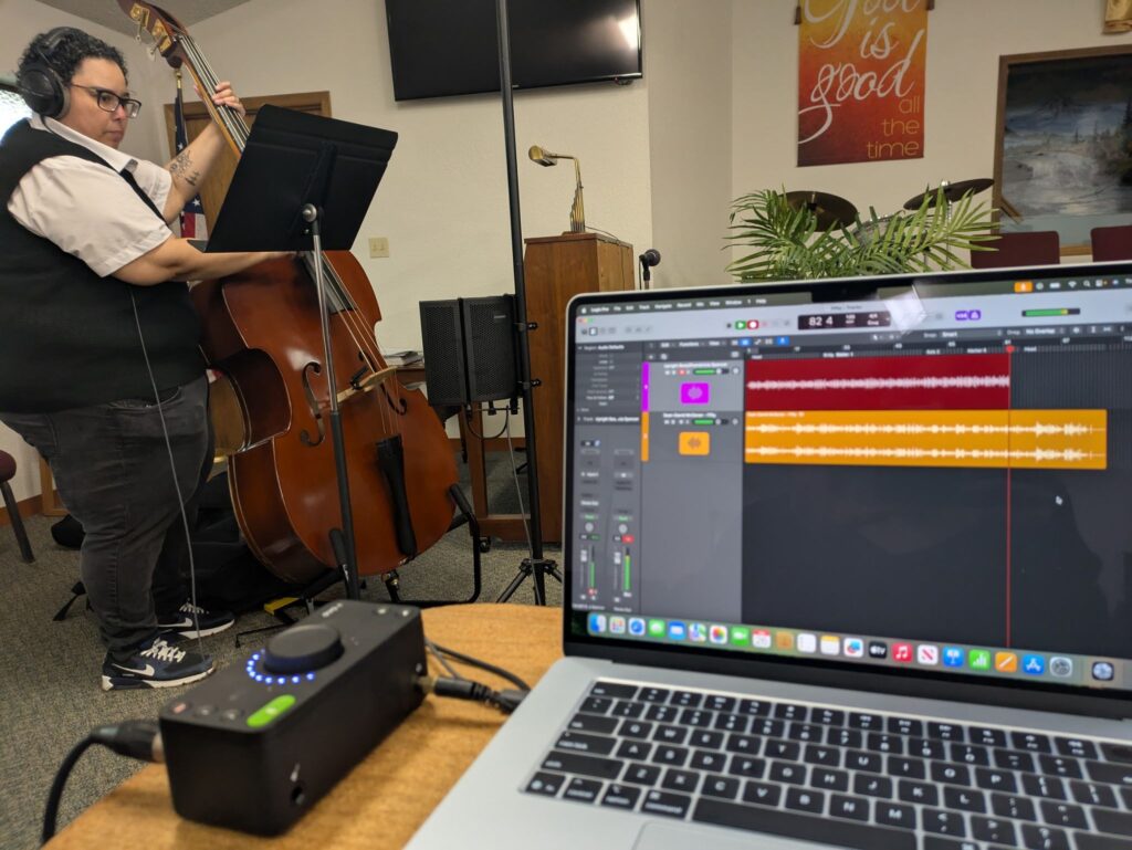 Shambricia laying down a bass part.